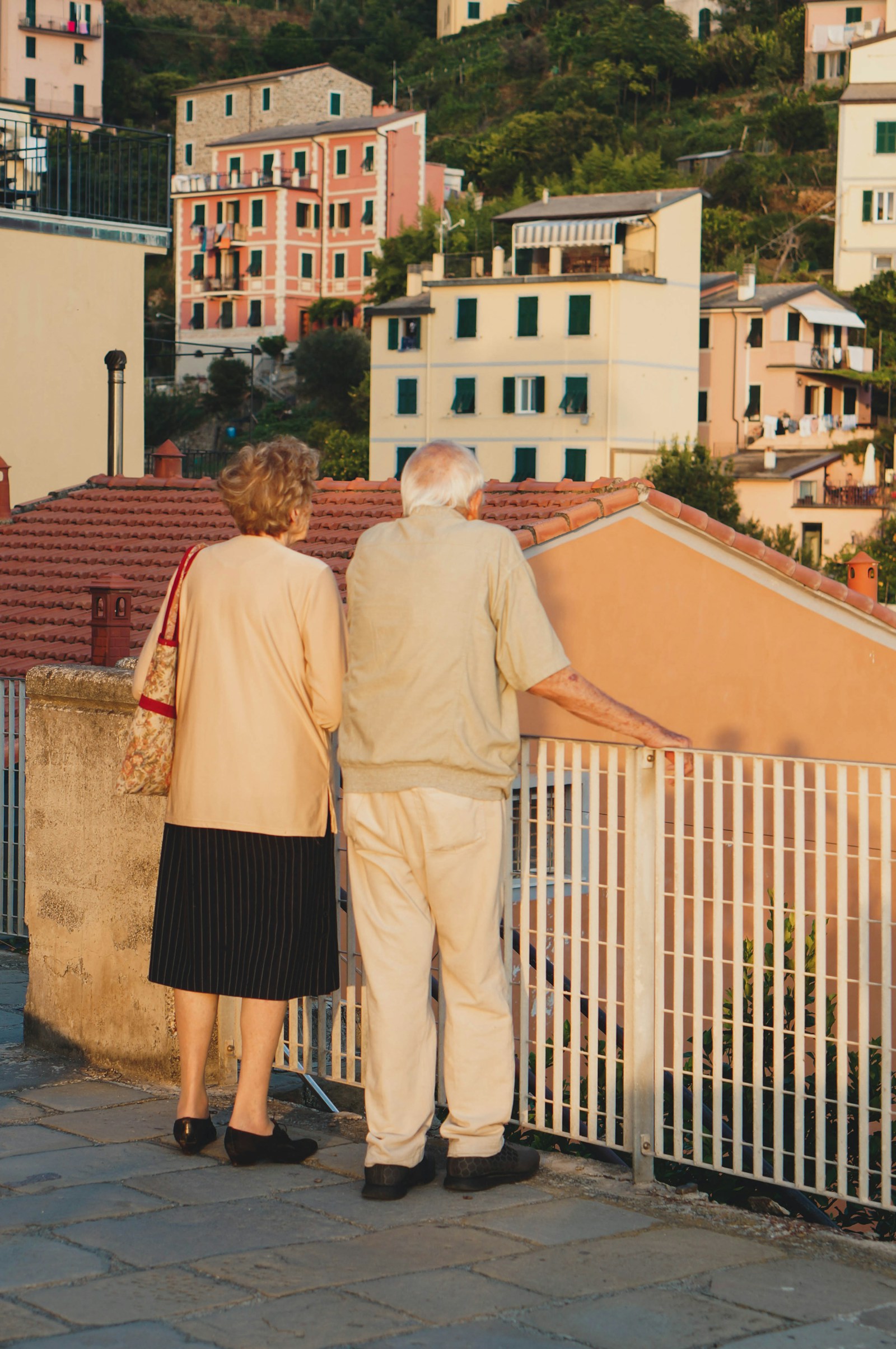 People aged 40 to 65 in front of a residential building in France